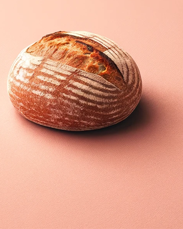 a loaf of sourdough bread on a plain background