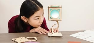 kid using KiwiCo Levitaing Lantern project kit