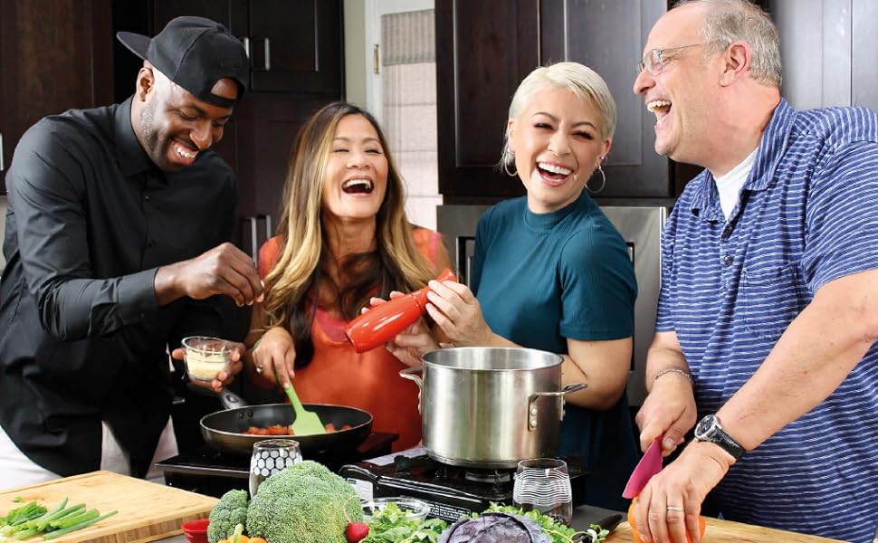 Katie and her friends cook a meal together in the kitchen