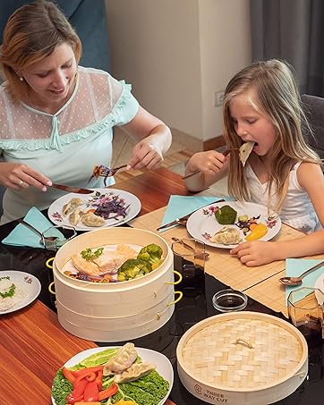 A family eating together while the steamer in on their table