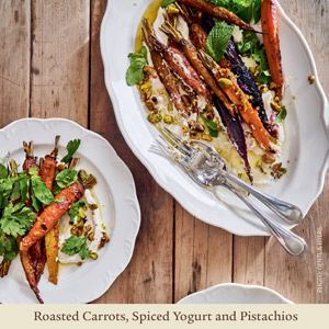 image of roasted carrots, spiced yogurt and pistachios