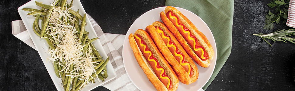 Keto hot dogs and green beans on blackboard table