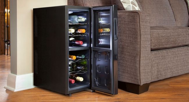 12-bottle dual zone wine cooler filled with red and white wine bottles in an elegant living room