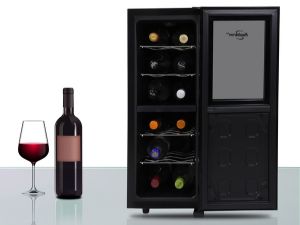 Thermoelectric wine cooler filled with bottles of red and white wine a glass of red wine beside it