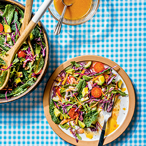 G-Money Mob Salad on a plate over a gingham table cloth