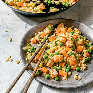 Shrimp Fried Rice on a gray plate with chopsticks