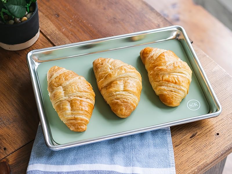 Sage green silicone baking sheet in quarter sheet size with croissants