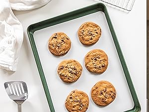 Blueberry muffins baked free-standing in silicone baking cups on a cookie sheet