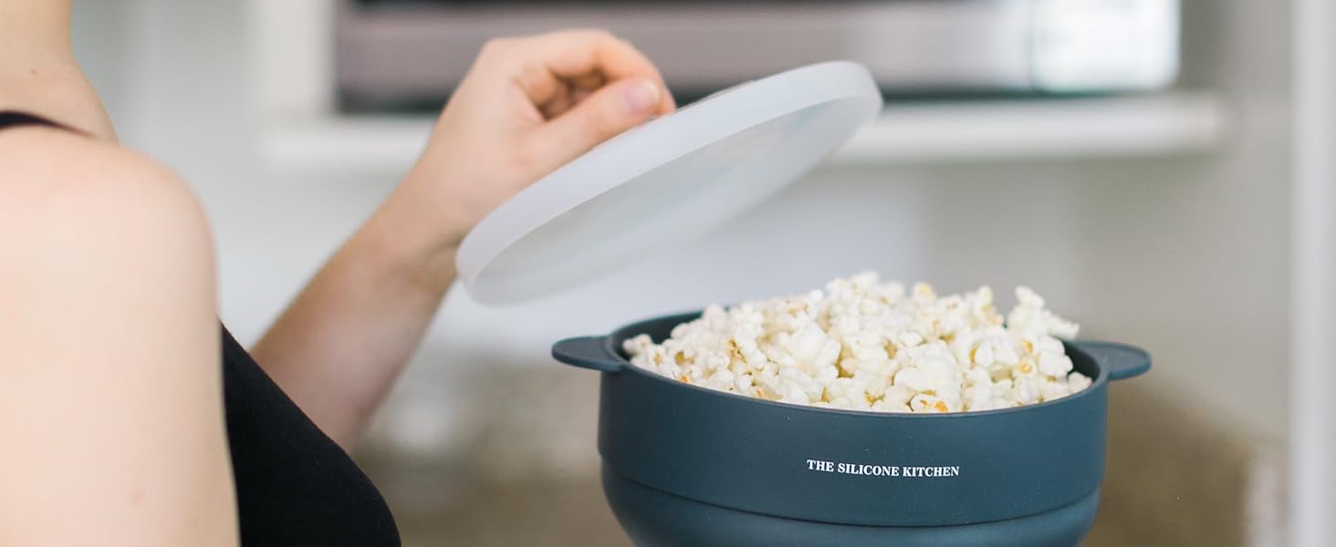 Microwave popcorn maker with a microwave in the background