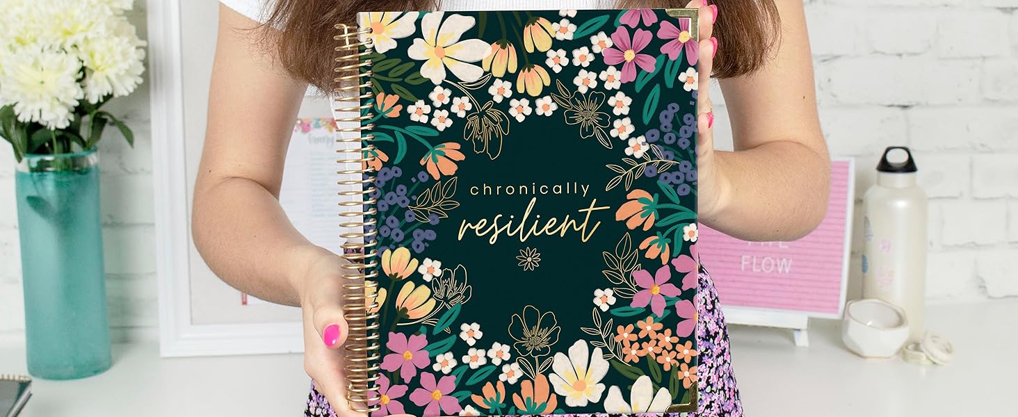 bloom Chronic Illness Planner chronically resilient floral agenda being held