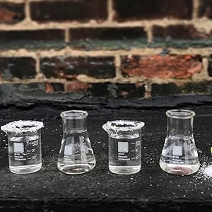 Comes with laboratory chemistry shot glasses. Two beakers and two flasks.